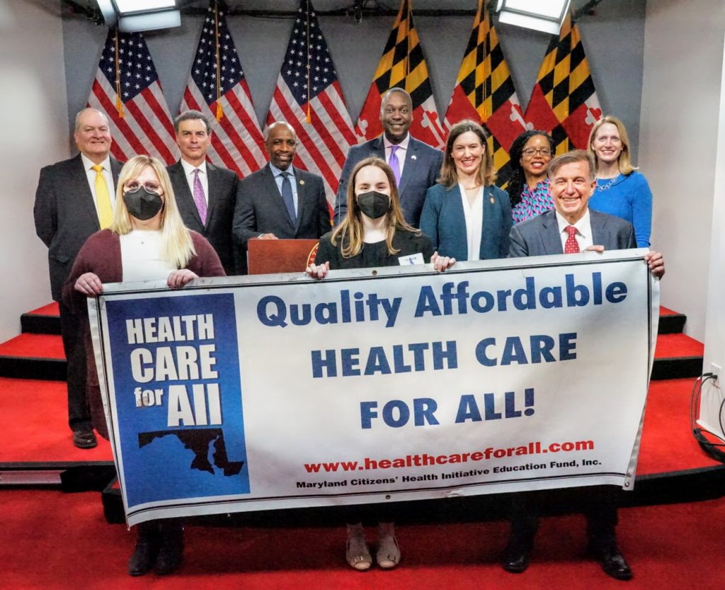 Legislators and advocates hold Health Care for All Sign