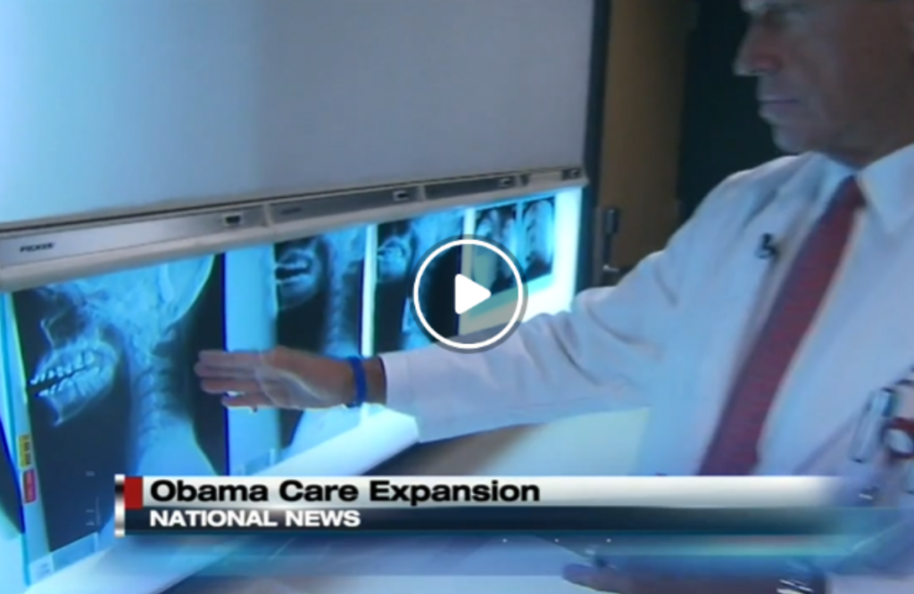 Stock photo of doctor reviewing x-rays with news title card which reads, "Obama Care Expansion; National News"